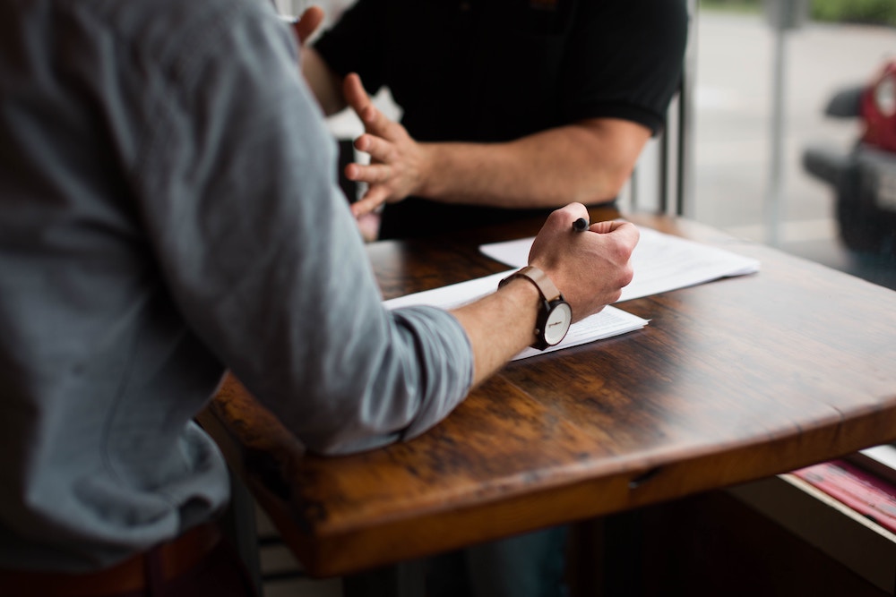 Michigan business owner meeting with an agent